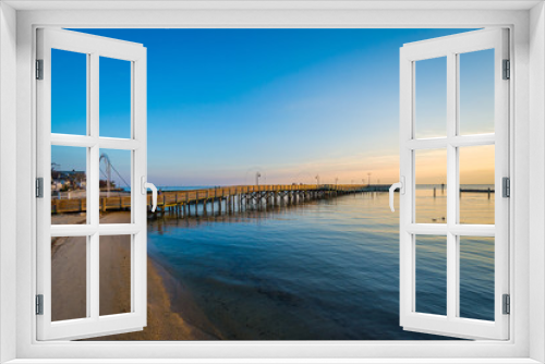Fototapeta Naklejka Na Ścianę Okno 3D - Fishing pier and the Chesapeake Bay at sunrise, in North Beach,