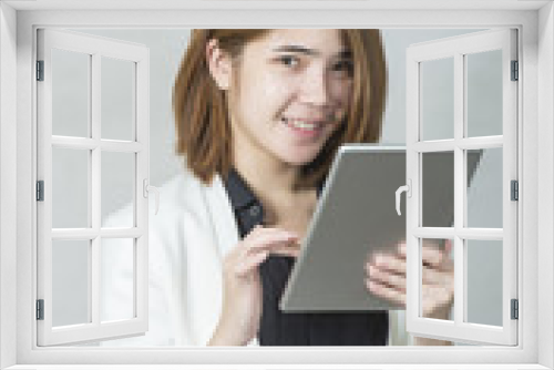 Business woman holding a tablet computer - over a white background