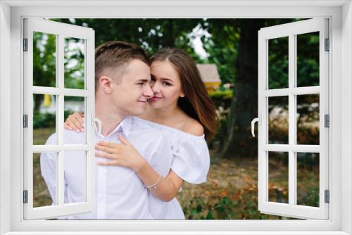 Young adult brunette man and woman in the park