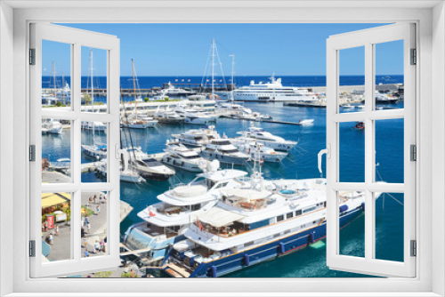 Fototapeta Naklejka Na Ścianę Okno 3D - Monaco, Monte-Carlo, Monaco Ville, 8 August 2016: Port Hercules, the preparation of the yacht show MYS, sunny day, many yachts and boats, RIVA, Prince's Palace of Monaco, megayachts, Massif of houses