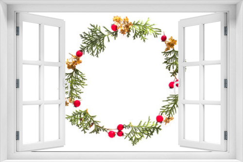 Fototapeta Naklejka Na Ścianę Okno 3D - Christmas frame made of green thuja twigs and red wild rose fruits on white background. Top view, flat lay. Copy space for text