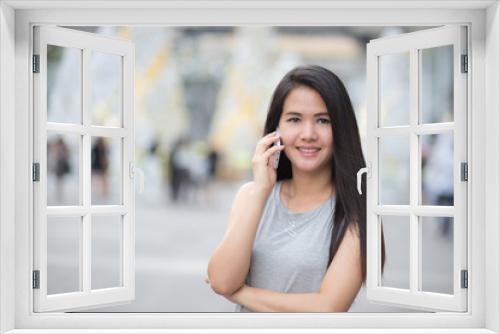 Woman use of the cellphone at outdoor.