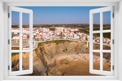 Fototapeta Naklejka Na Ścianę Okno 3D - Panoramic view of Zambujeira de Mar and beach with holidaymakers people aerial