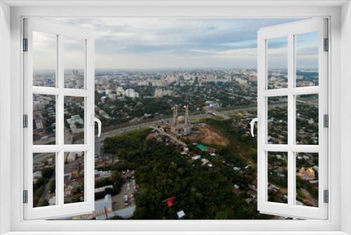 Autumn in city. Panoramic aerial view at road, forest, river.