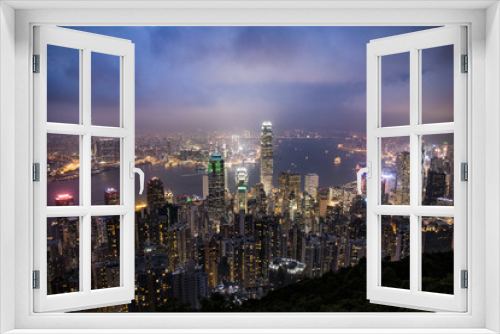 Fototapeta Naklejka Na Ścianę Okno 3D - Hong Kong, China skyline panorama from across Victoria Harbor. Hong Kong city skyline view from harbor with skyscrapers buildings reflect in water at sunset