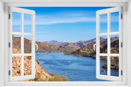 Fototapeta Naklejka Na Ścianę Okno 3D - View of Canyon Lake from the Apache Trail looking down to the marina and mountains beyond