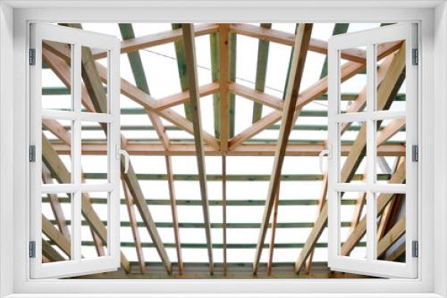 Fototapeta Naklejka Na Ścianę Okno 3D - Wooden roof frame, the roof structure.