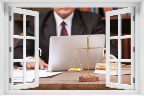 Fototapeta Naklejka Na Ścianę Okno 3D - Scales of justice on wooden table and male lawyer on background