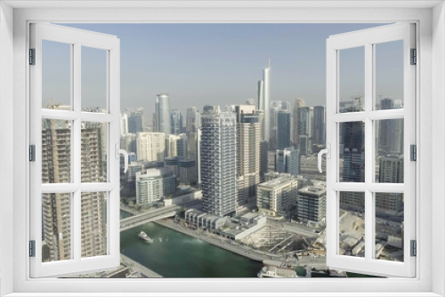 Fototapeta Naklejka Na Ścianę Okno 3D - Aerial view of Dubai Marina buildings along artificial canal