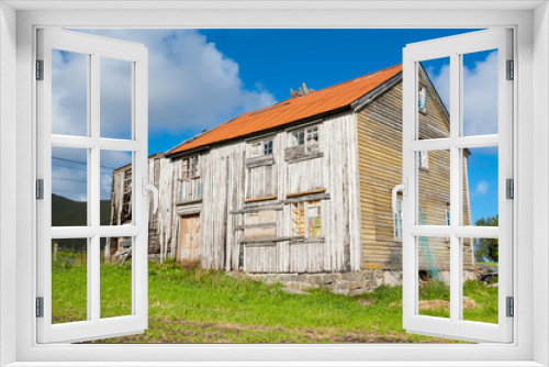 Fototapeta Naklejka Na Ścianę Okno 3D - Old and abandoned wooden house with red roof in the Norwegian countryside