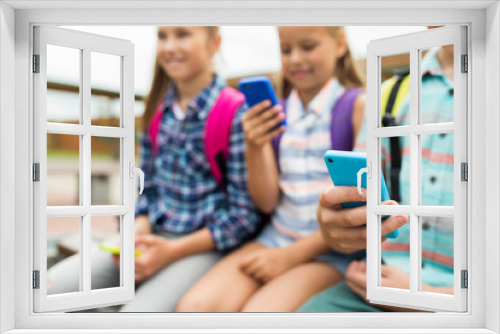 elementary school students with smartphones