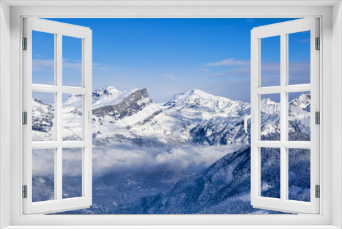 Fototapeta Naklejka Na Ścianę Okno 3D - Mountain Peaks Above the Clouds
