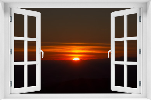 Fototapeta Naklejka Na Ścianę Okno 3D - Fiery sunset from mountain pick with thin glazes in the sky evening. Fall season. Orobie alps. Rena pick. Bergamo Italy. In the distance the Monviso.