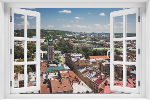 Fototapeta Naklejka Na Ścianę Okno 3D - Blue cloudy sky and town. Trees and buildings. Townscape at daytime.