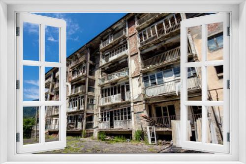 Fototapeta Naklejka Na Ścianę Okno 3D - Abandoned mining ghost-town Polyana, Abkhazia. Destroyed empty houses 