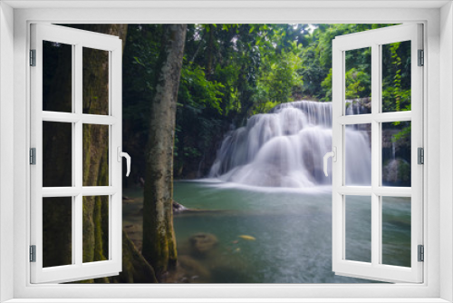 Fototapeta Naklejka Na Ścianę Okno 3D - Erawan Waterfall, beautiful waterfall with sunlight rays in deep forest, Erawan National Park in Kanchanaburi, Thailand