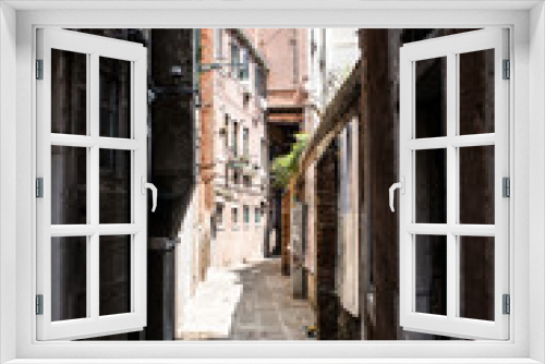 Fototapeta Naklejka Na Ścianę Okno 3D - Historic narrow street of Venice, second