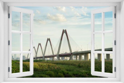 Fototapeta Naklejka Na Ścianę Okno 3D - Nhat Tan bridge viewing from wild land on Red River riverbed