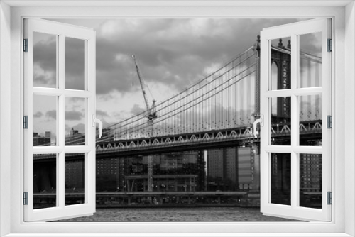 Fototapeta Naklejka Na Ścianę Okno 3D - Manhattan bridge over the river and the city in black and white style, New York