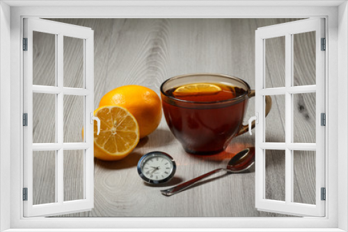 Fototapeta Naklejka Na Ścianę Okno 3D - Cup of tea with lemon on wooden desk