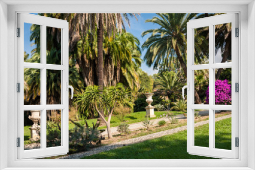 Fototapeta Naklejka Na Ścianę Okno 3D - Beautiful garden with palm trees and a fountain in San Remo