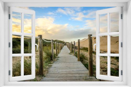 Fototapeta Naklejka Na Ścianę Okno 3D - Wooden path to the beach on the dunes. Guincho beach in Cascais, Portugal