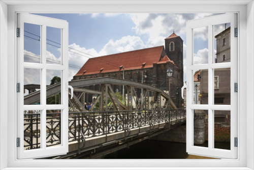 Fototapeta Naklejka Na Ścianę Okno 3D - Mill bridge - Most Mlynski and church of Our Lady on Sand in Wroclaw. Poland