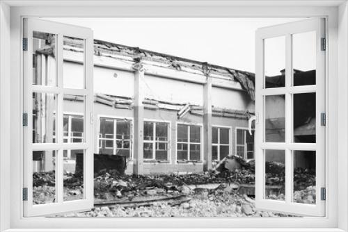 Fototapeta Naklejka Na Ścianę Okno 3D - Demolition of old school building. Black and white.