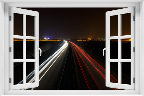 Fototapeta Naklejka Na Ścianę Okno 3D - Long time exposure on a german street after sunset in winter