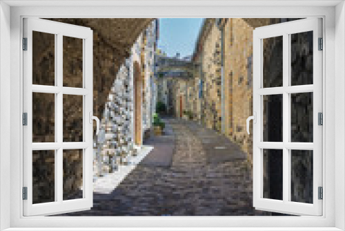 Fototapeta Naklejka Na Ścianę Okno 3D - Pedestrian road under the houses  in the picturesque village of Mirabel.in the Ardeche department in France.