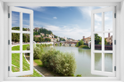 Fototapeta Naklejka Na Ścianę Okno 3D - Sunny view of Adige river and Stone Bridge (Ponte di Pietra) in Verona, Veneto region, Italy.