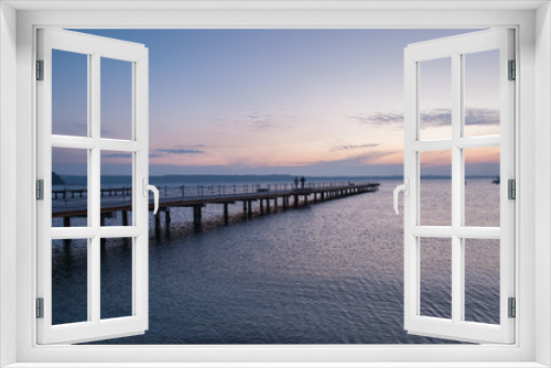 Fototapeta Naklejka Na Ścianę Okno 3D - Wooden pier entering into the sea with colorful morning sky