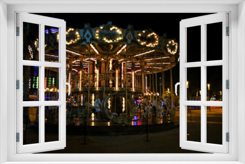 Fototapeta Naklejka Na Ścianę Okno 3D - Night view of the illuminated vintage carousel