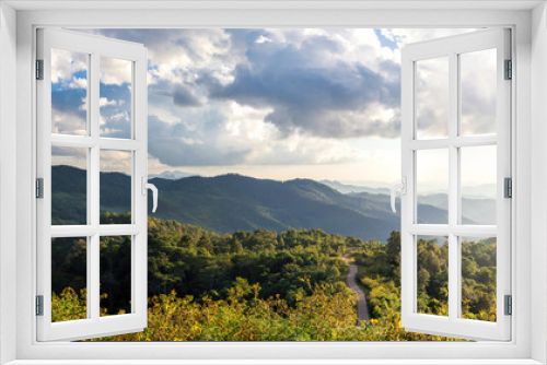Fototapeta Naklejka Na Ścianę Okno 3D - View of mountain peaks, coniferous tropical forest. Panorama