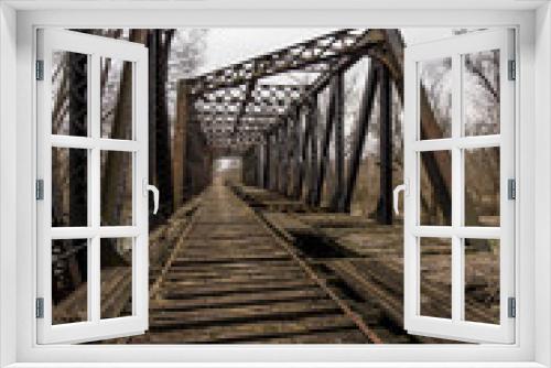 Fototapeta Naklejka Na Ścianę Okno 3D - Abandoned, Derelict Railroad Bridge over Shenango River in Pennsylvania