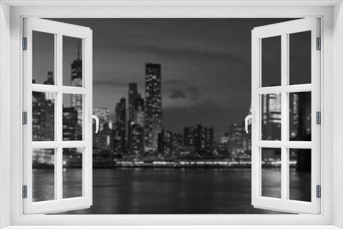 Fototapeta Naklejka Na Ścianę Okno 3D - New York city with Brooklyn Bridge, iconic skyline panorama at night in black and white