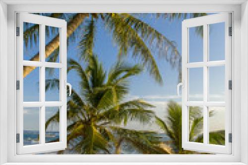 Fototapeta Naklejka Na Ścianę Okno 3D - Tropischer Strand mit Palmen im Abendlicht