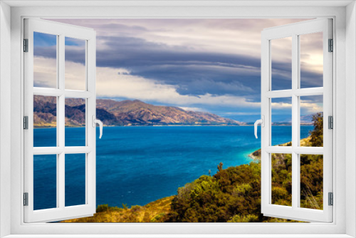 Fototapeta Naklejka Na Ścianę Okno 3D - Landscape view of Lake Hawea and mountains with dramatic sky, NZ