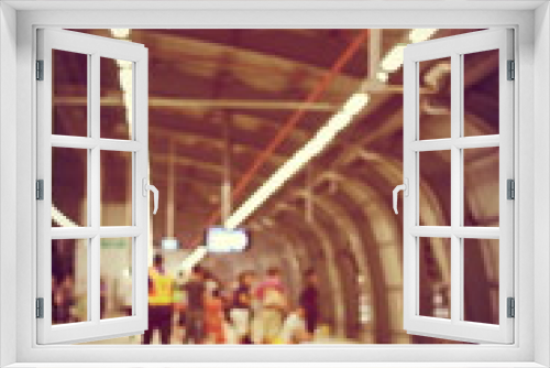 blurred image of Passengers Waiting for train & security man is working at railway station, train station, Railway train on the railroad.Bangkok. Thailand. vintage tone filter