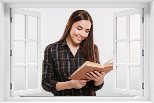 Smiling Woman in shirt reading book