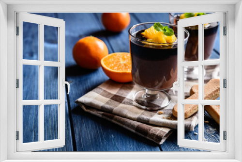 Fototapeta Naklejka Na Ścianę Okno 3D - Chocolate pudding topped with orange pieces