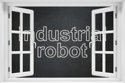 Industry concept: Industrial Robot on chalkboard background
