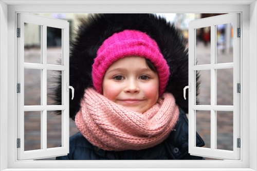 Portrait of happy little girl at a port