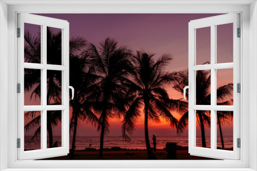 Fototapeta Naklejka Na Ścianę Okno 3D - Silhouette of coconut tree with Twilight sunset at the beach, background.