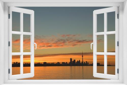 Fototapeta Naklejka Na Ścianę Okno 3D - Skyline of Toronto against a beautiful sunset