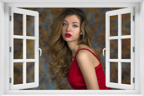 Young beautiful blonde woman in red dress