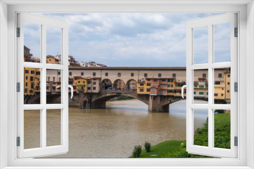 Famous Ponte Vecchio bridge across the river Arno in Florence, Italy
