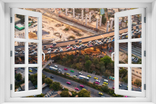 Fototapeta Naklejka Na Ścianę Okno 3D - Traffic jam in rush hour,expressway. Freight and passenger train waiting at the train station parking lot.Cargo transit.import export and business logistic.Aerial view.Top view. Railway construction