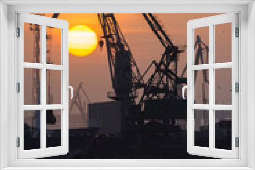 Fototapeta Naklejka Na Ścianę Okno 3D - Industrial port dockyard with sunset in Portrait