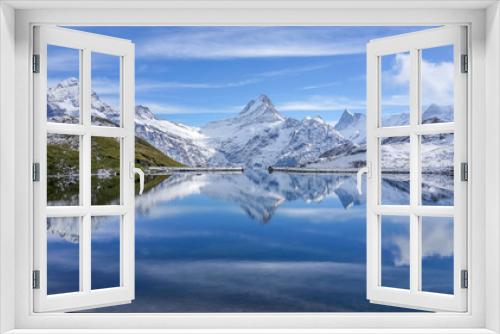 Fototapeta Naklejka Na Ścianę Okno 3D - The snow mountain with reflection in lake and clear blue sky in Switzerland